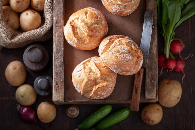 Tasty and fresh potato buns in wooden basement