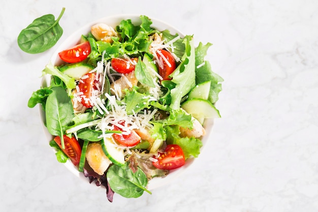 Tasty fresh salad with chicken and vegetables