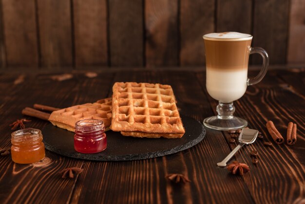 Tasty fresh Vienna wafers, jam and cup of coffee 