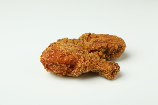 Tasty fried chicken on white background, close up