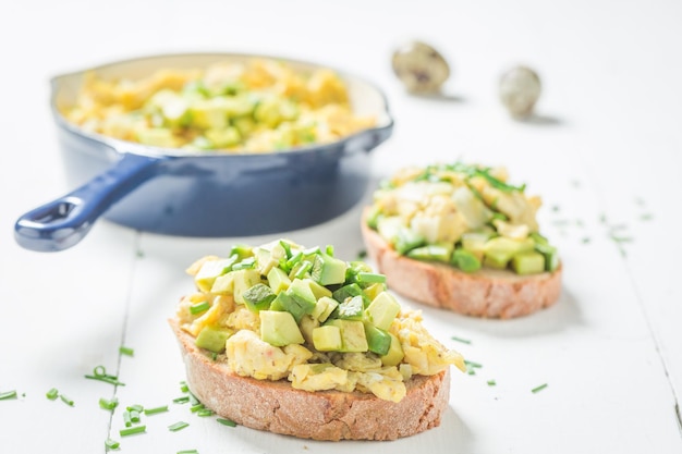 Tasty fried eggs with avocado for breakfast