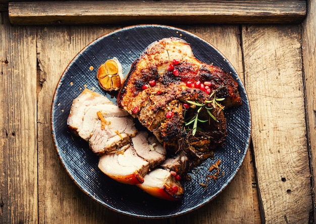 Tasty fried pork belly with spices and herbs Fatty piece of meat