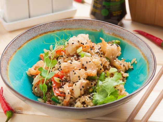 Tasty fried rice with shrimp in a bowl