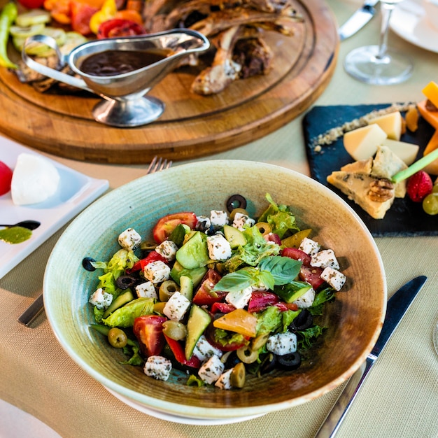 Tasty greek salad with cheese, olives and more