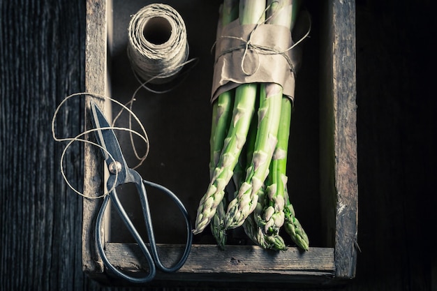 Tasty green asparagus in a wooden box