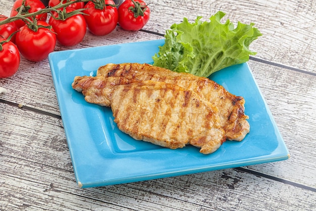 Photo tasty grilled pork steak with ketchup