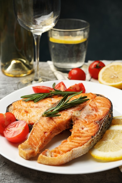 tasty grilled salmon on gray background