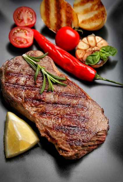 Tasty grilled steak on plate