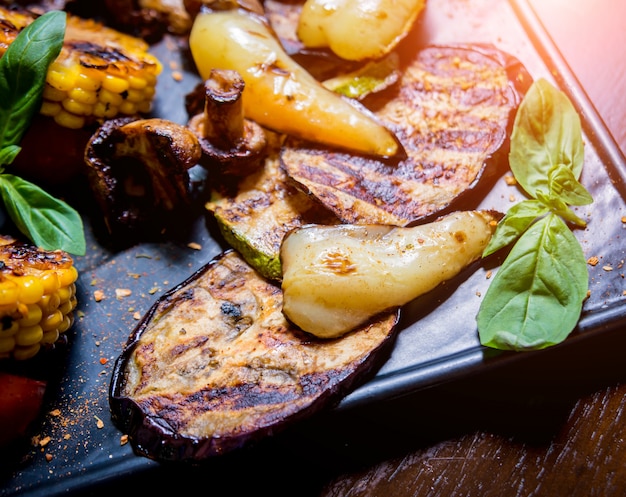 Tasty grilled vegetables on big plate. Healthy food. Restaurant.