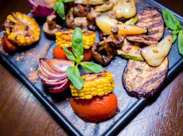 Tasty grilled vegetables on big plate. Healthy food. 