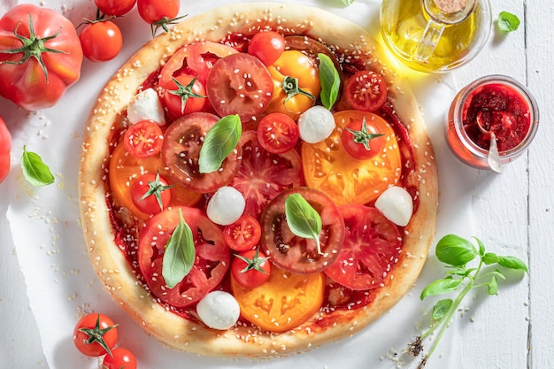 Tasty and healthy pizza Margherita made of mozzarella and tomatoes