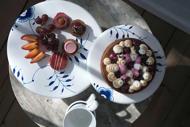 Tasty homemade cake on white plate overhead shot