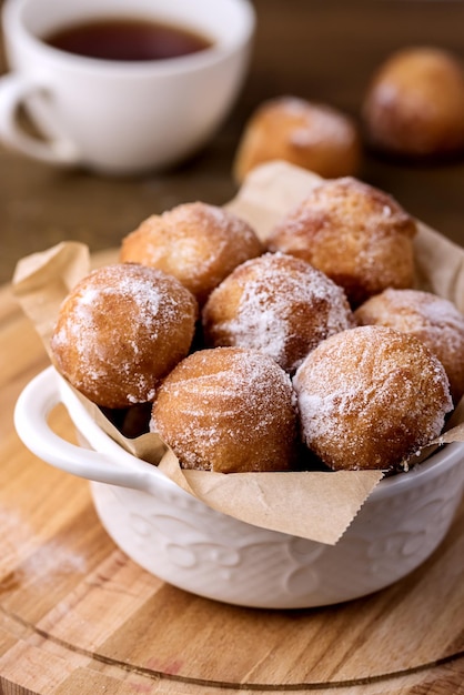 Tasty Homemade Cottage Cheese Donuts in Sugar Powder Wooden Background Donuts