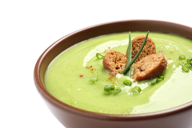 Tasty homemade zucchini cream soup isolated on white closeup