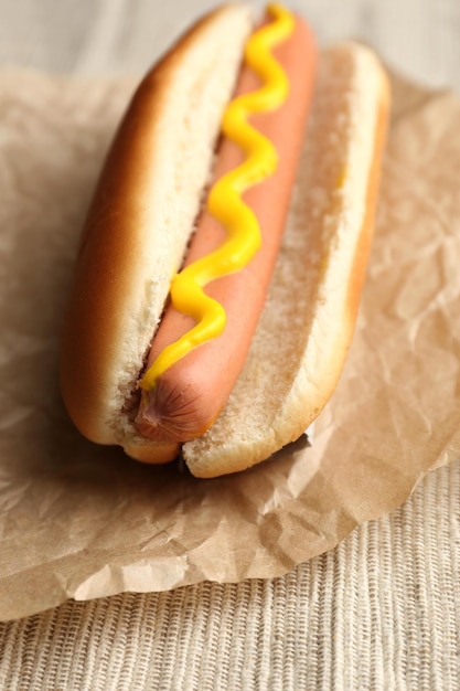 Tasty hot dog on paper