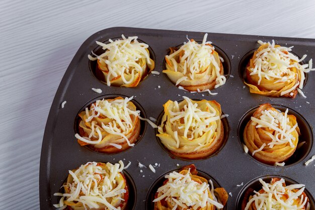 Tasty hot homemade bacon with baked rolls roses potato