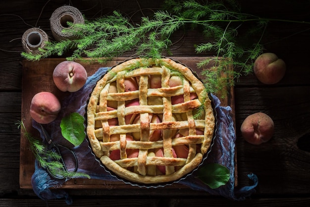 Tasty and hot peaches pie made of fresh ingredients