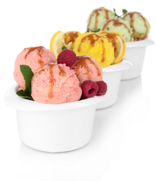 Tasty ice cream scoops in bowls isolated on white