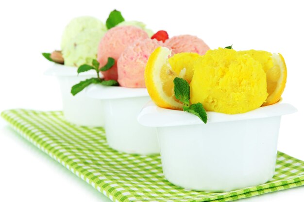 Tasty ice cream scoops in bowls isolated on white