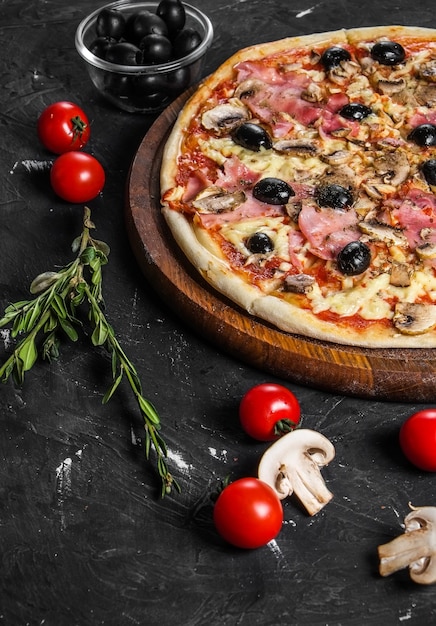 Tasty italian capricciosa pizza with fresh ingredients