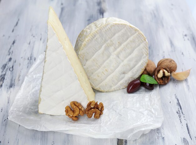 Tasty Italian cheese on wooden table