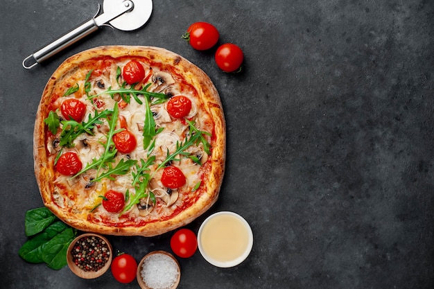 tasty italian pizza with mozzarella cheese, mushrooms, tomato, bell pepper, onion