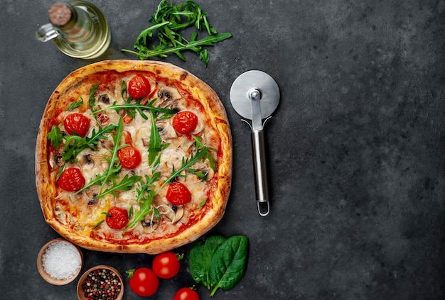 tasty italian pizza with mozzarella cheese, mushrooms, tomato, bell pepper, onion