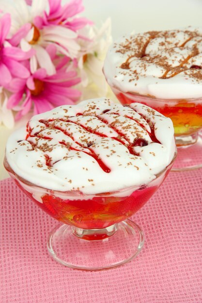 Tasty jelly in bowls on table closeup