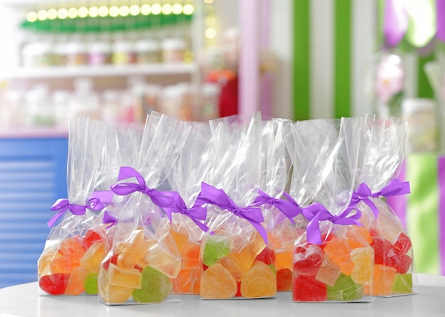 Tasty jelly candies in bags at shop