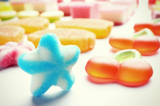 Tasty jelly candies on light background closeup