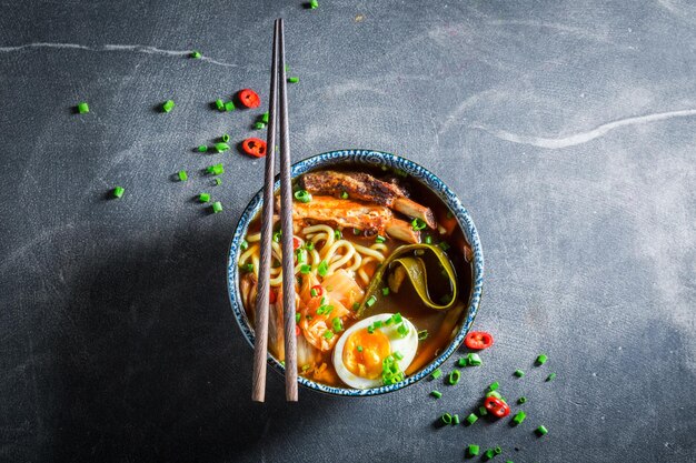 Tasty Kimchi soup with chive and noodles