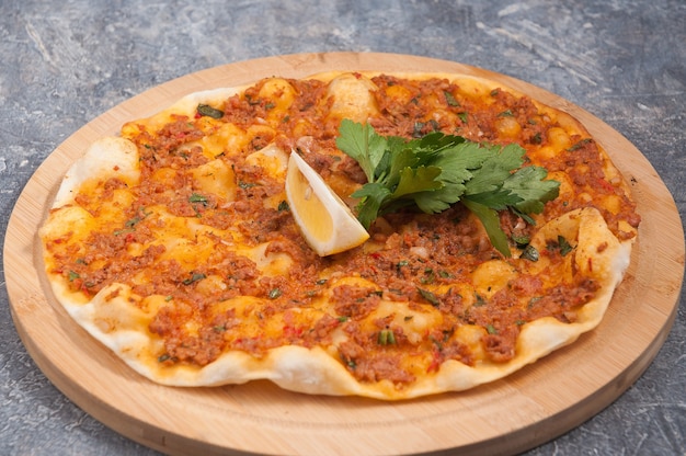 Tasty lahmacun is a Turkish dish similar to a pizza
