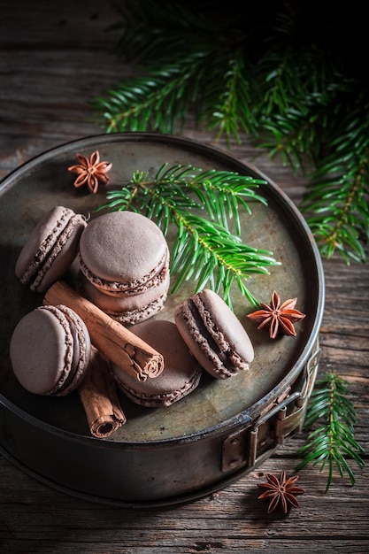 Tasty macaroons with cinnamon and chocolate for Christmas