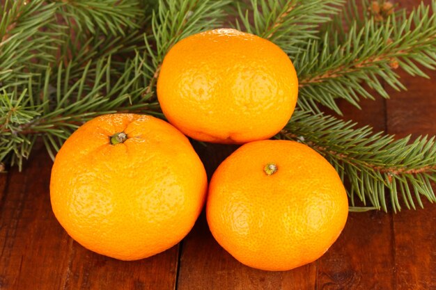 Tasty mandarines on wooden background