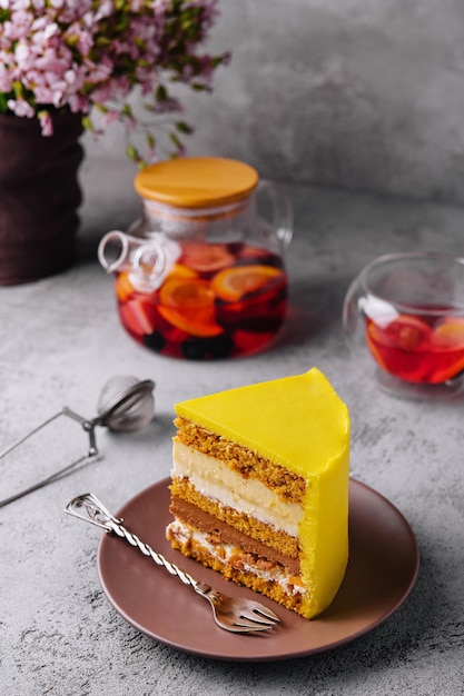 Tasty mango mousse cake on plate