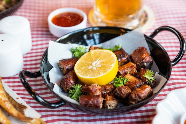 Tasty meat meal roulette with lemon and beer