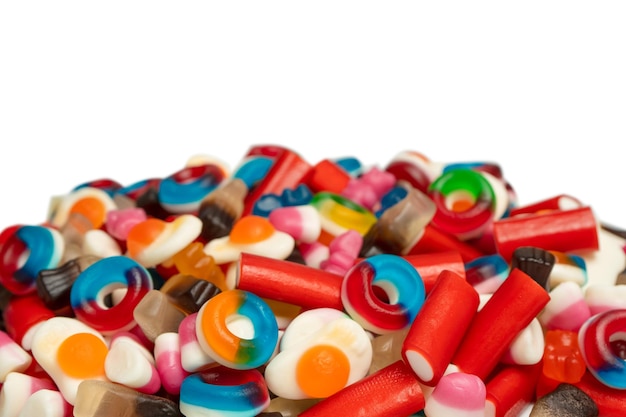 Tasty mix of jelly colorful candies isolated on a white background