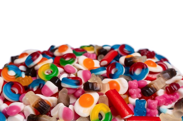 Tasty mix of jelly colorful candies isolated on a white background