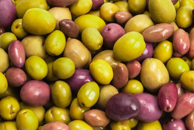 Tasty mix olives background. Top view.