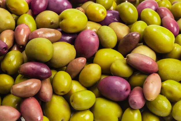 Tasty mix olives background.