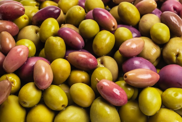 Tasty mix olives top view closeup