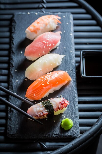 Tasty Nigiri sushi with octopus prawn and salmon