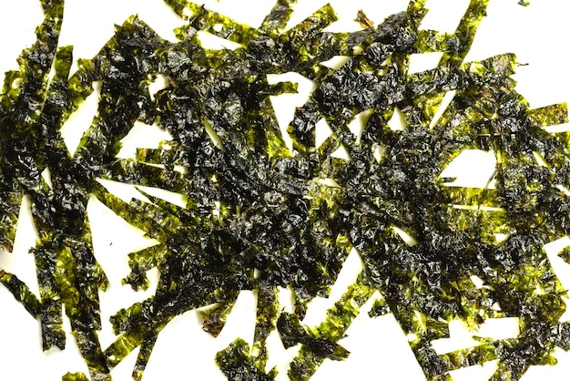 Tasty nori seaweed isolated on white background