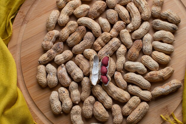 Tasty nuts in bamboo wooden background