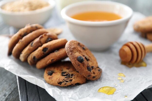 Tasty oatmeal cookies on table