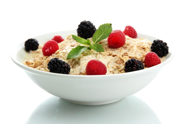 Tasty oatmeal with berries isolated on white