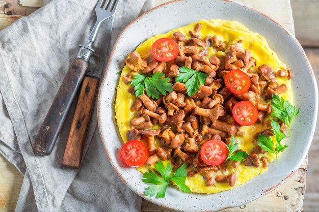 Tasty omelette made of fresh chanterelles mushrooms