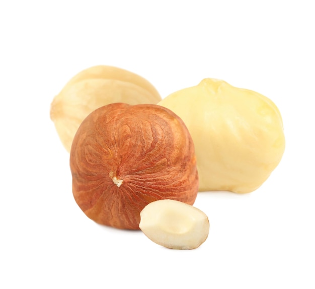 Tasty organic hazelnuts on white background Healthy snack