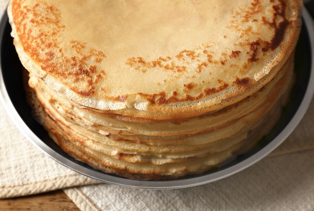 Tasty pancakes on pan closeup