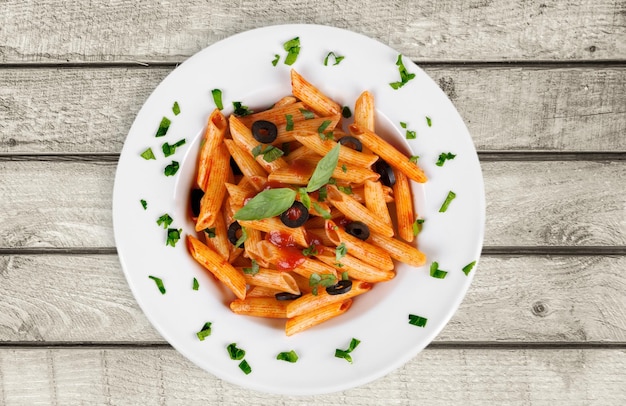 Tasty  pasta and parsley on  table.